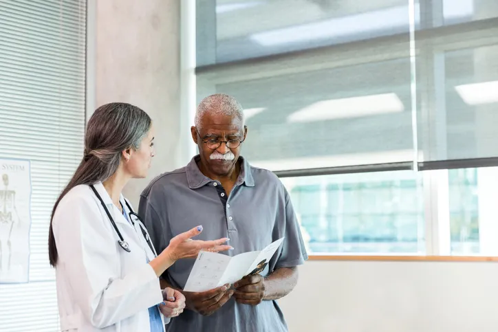 senior patient talking to a doctor