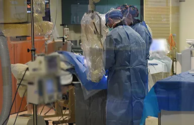 Dr. McKechnie performing first robotic-assisted coronary angioplasty with Corindus