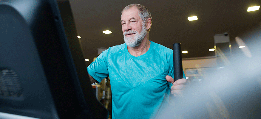 Fit man working out on an elliptical