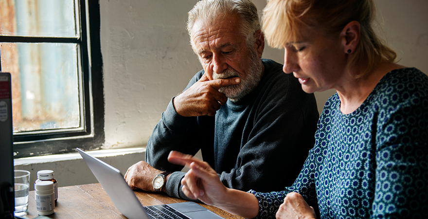 Two older adults making plans for the future