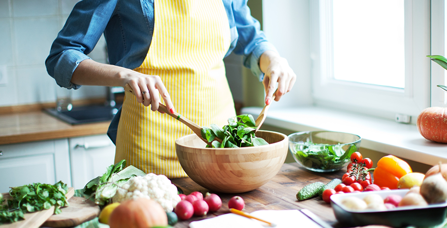 A woman preparing a healthy dinner