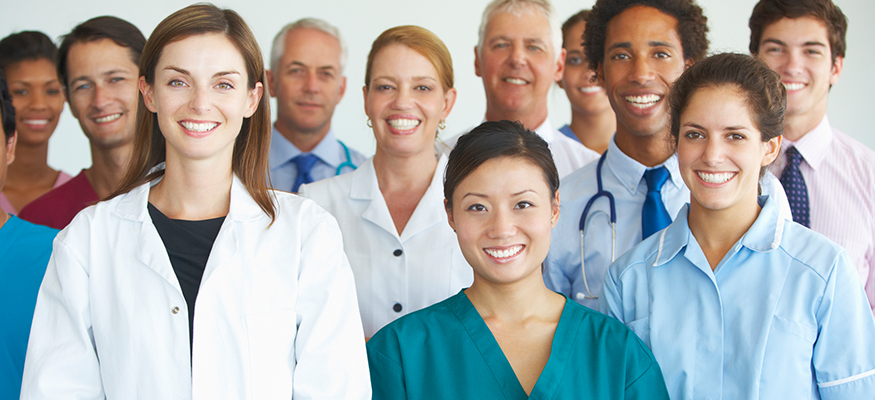 A diverse group of people smiling at the camera