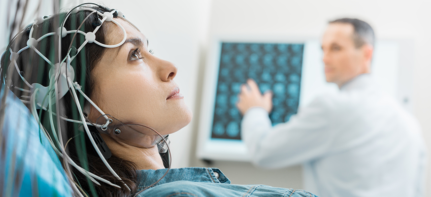 A woman undergoing electroencephalography