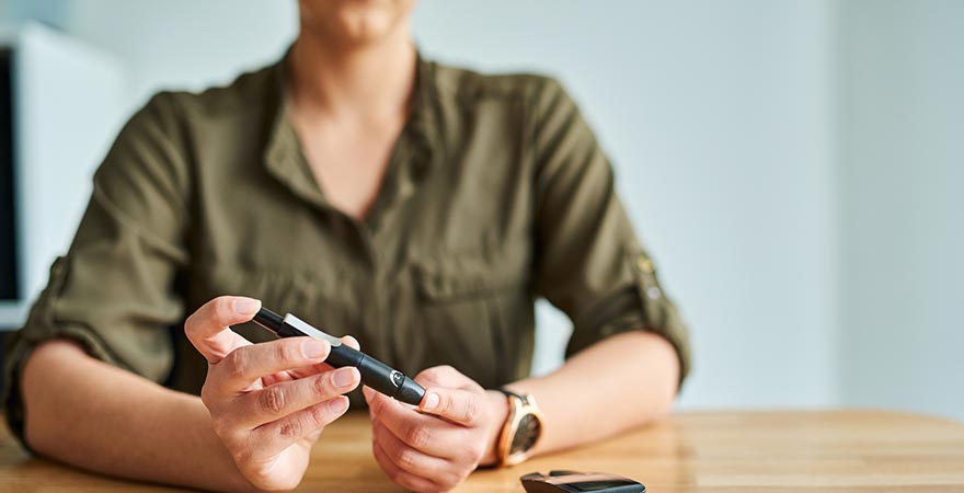 A woman checking her glucose levels