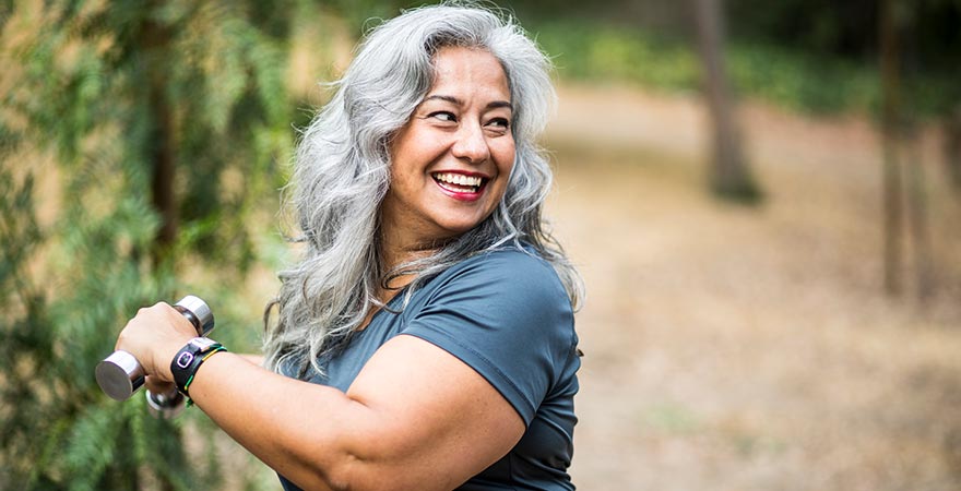 An older woman working out outdoors