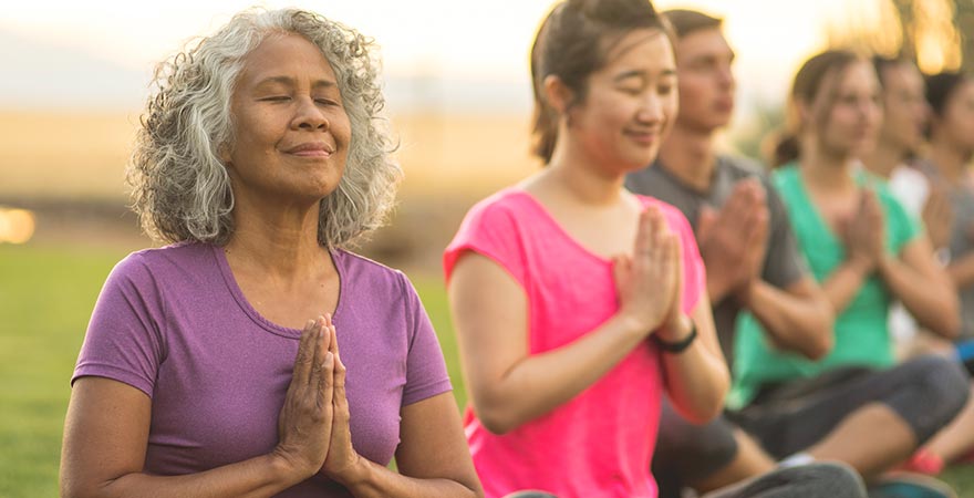 A yoga class outdoors.