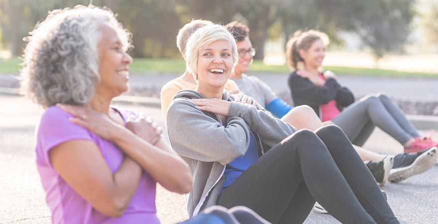 A group of women working out outside