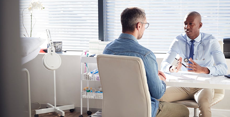 A male patient receiving a pain management consult