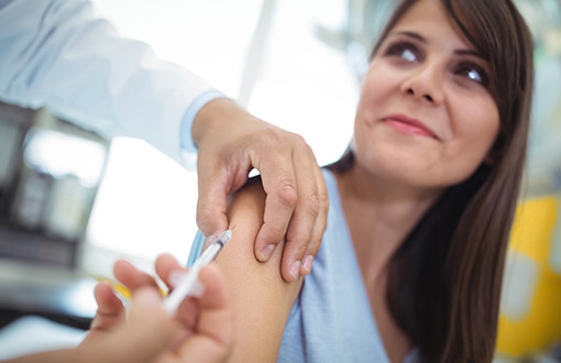 A woman receiving a flu shot