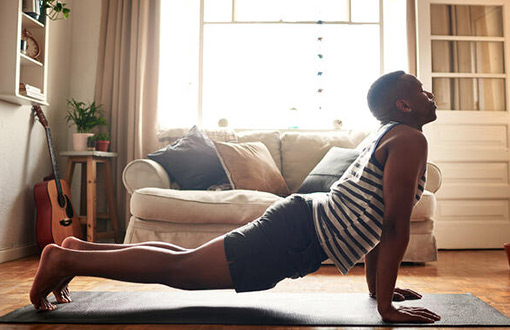 A man doing yoga at home