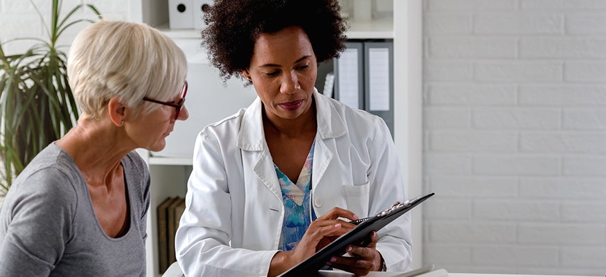 A doctor talking through pain management options