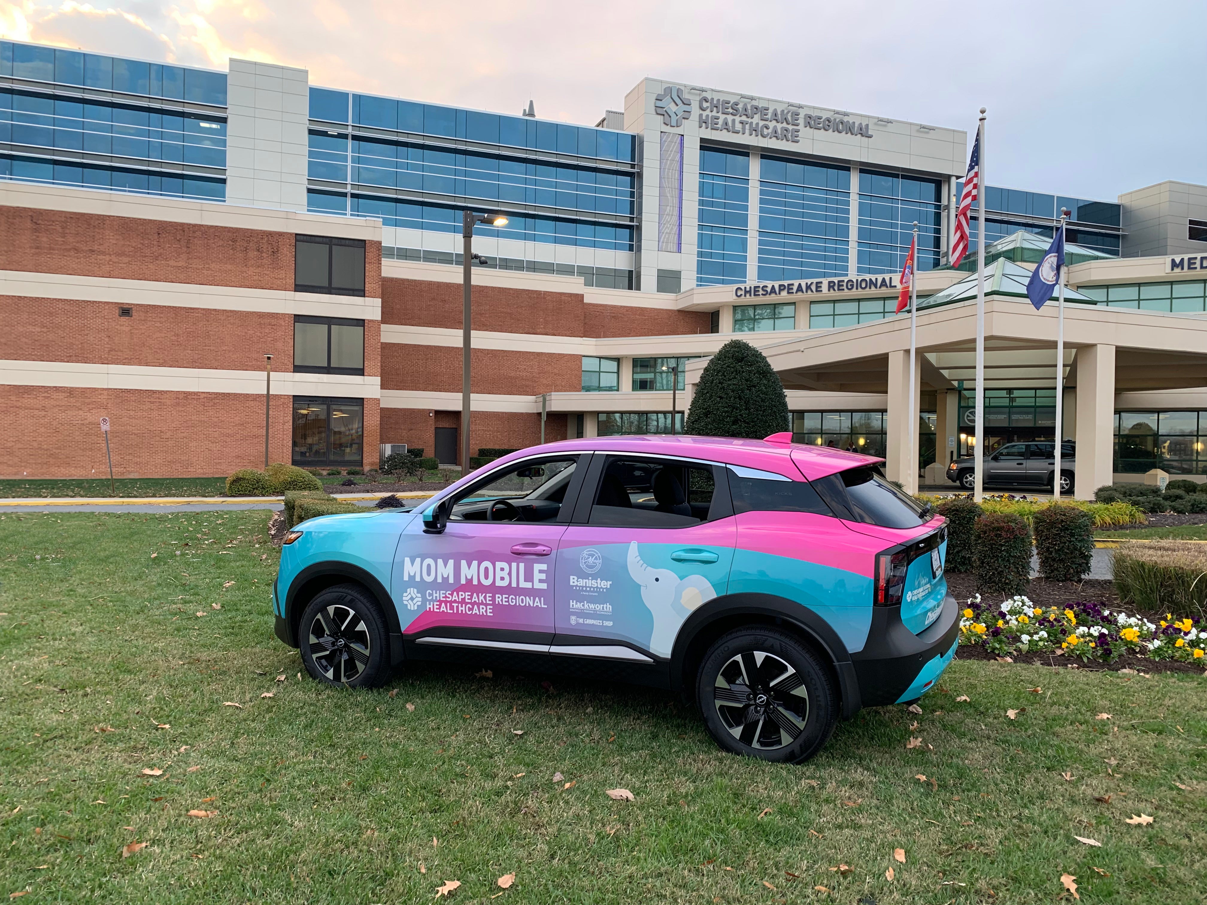 A photo of a turquoise, pink and purple sedan with "Mom Mobile" on the side and the Chesapeake Regional Healthcare logo.