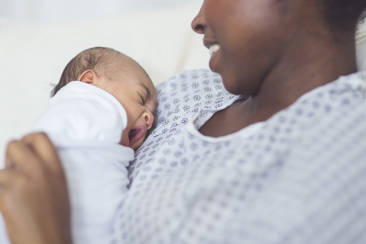 mom holds infant to chest