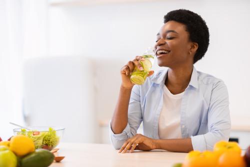 Woman Drinking Infused Water