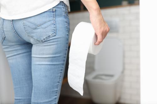 Woman Holding Toilet Paper