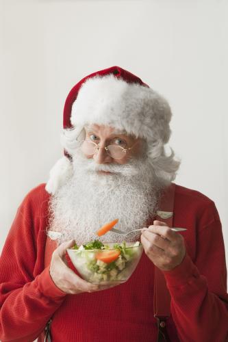 Santa eating healthy fruit