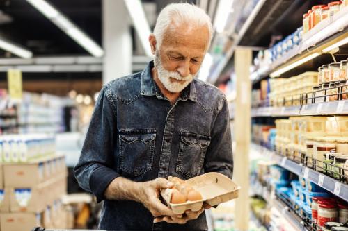 Man looking at eggs