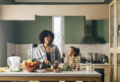 Mother and daughter cooking healthy foods
