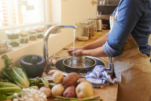 home chef washing fruits and vegetables 
