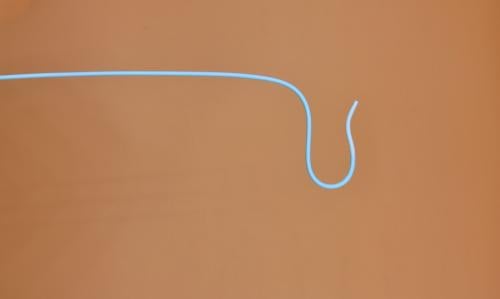 A curved diagnostic catheter used in interventional radiology and cardiology