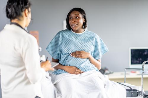 Pregnant mom discussing options with her doctor