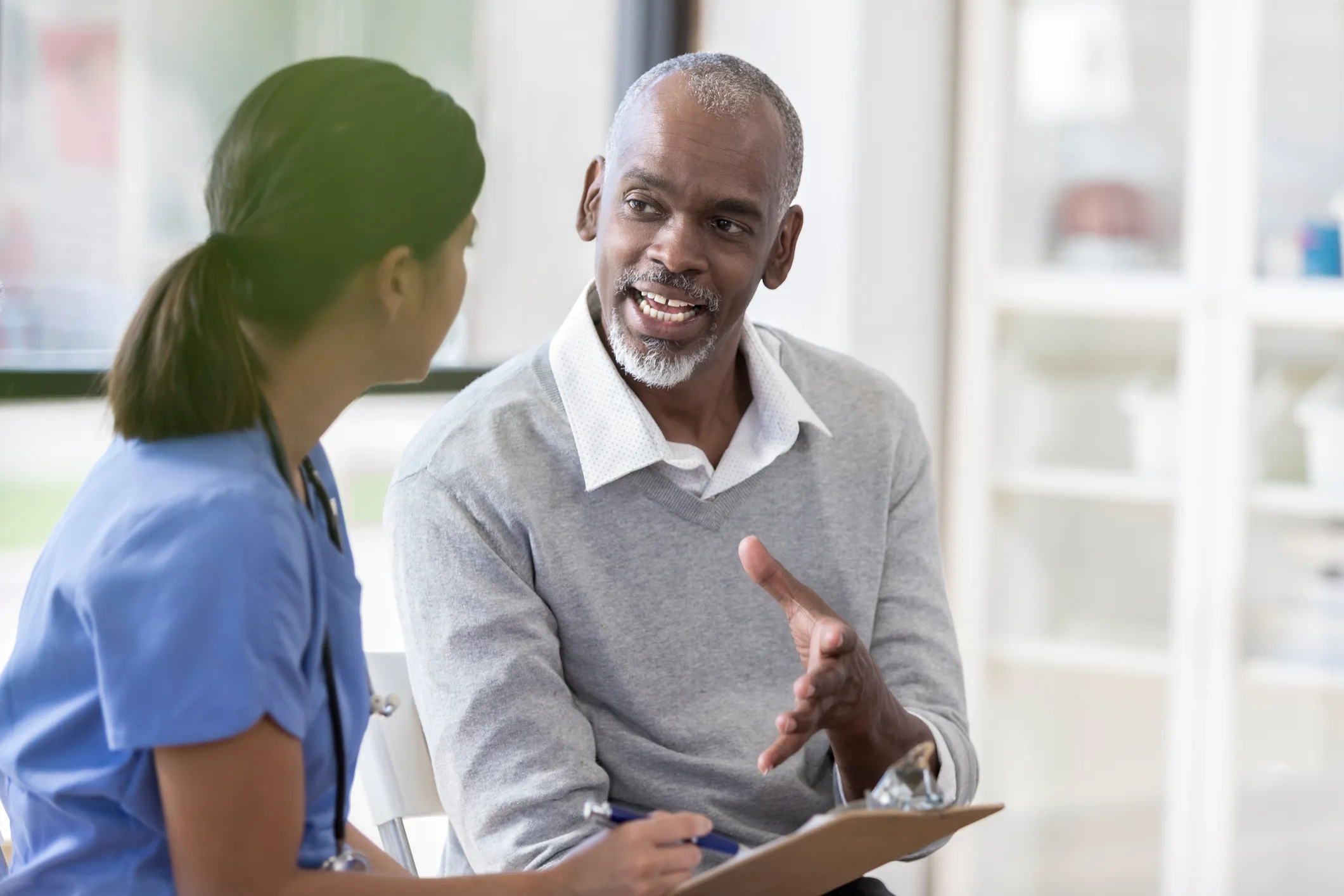 man talking to doctor