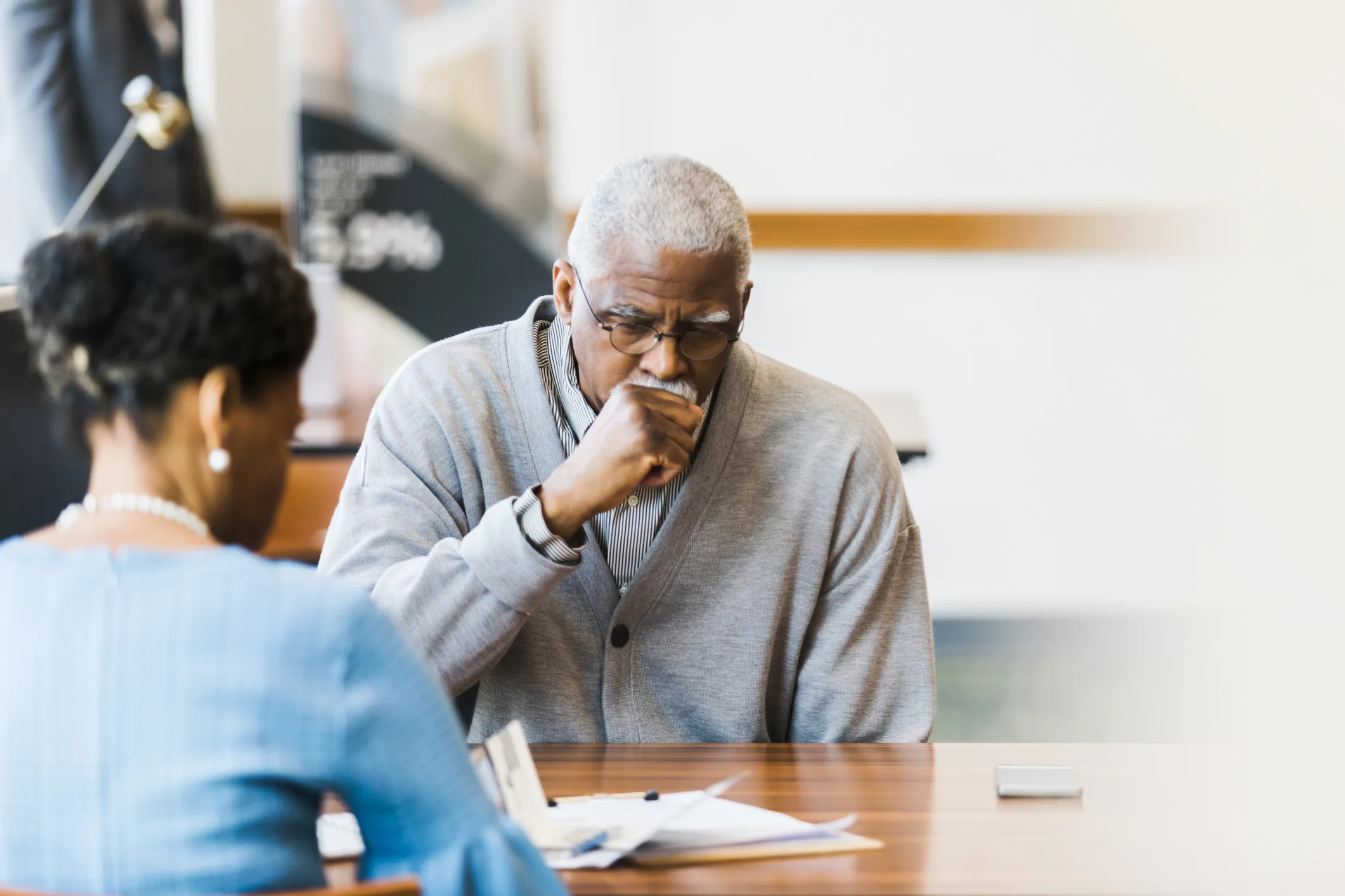 older man coughing