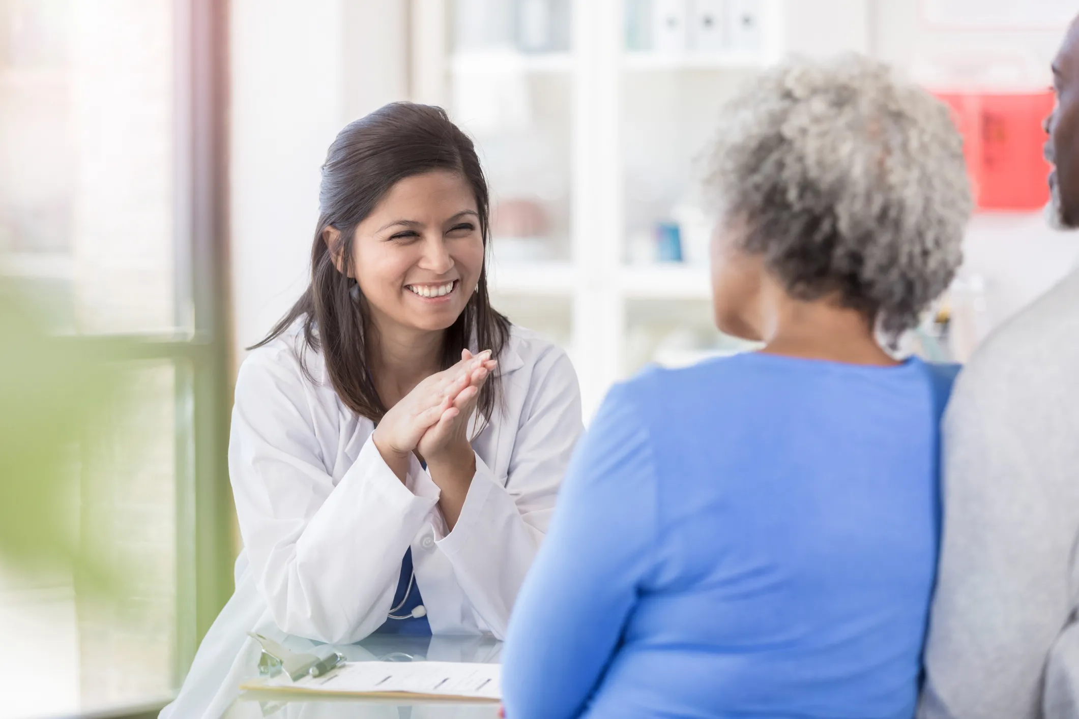 woman talking to doctor