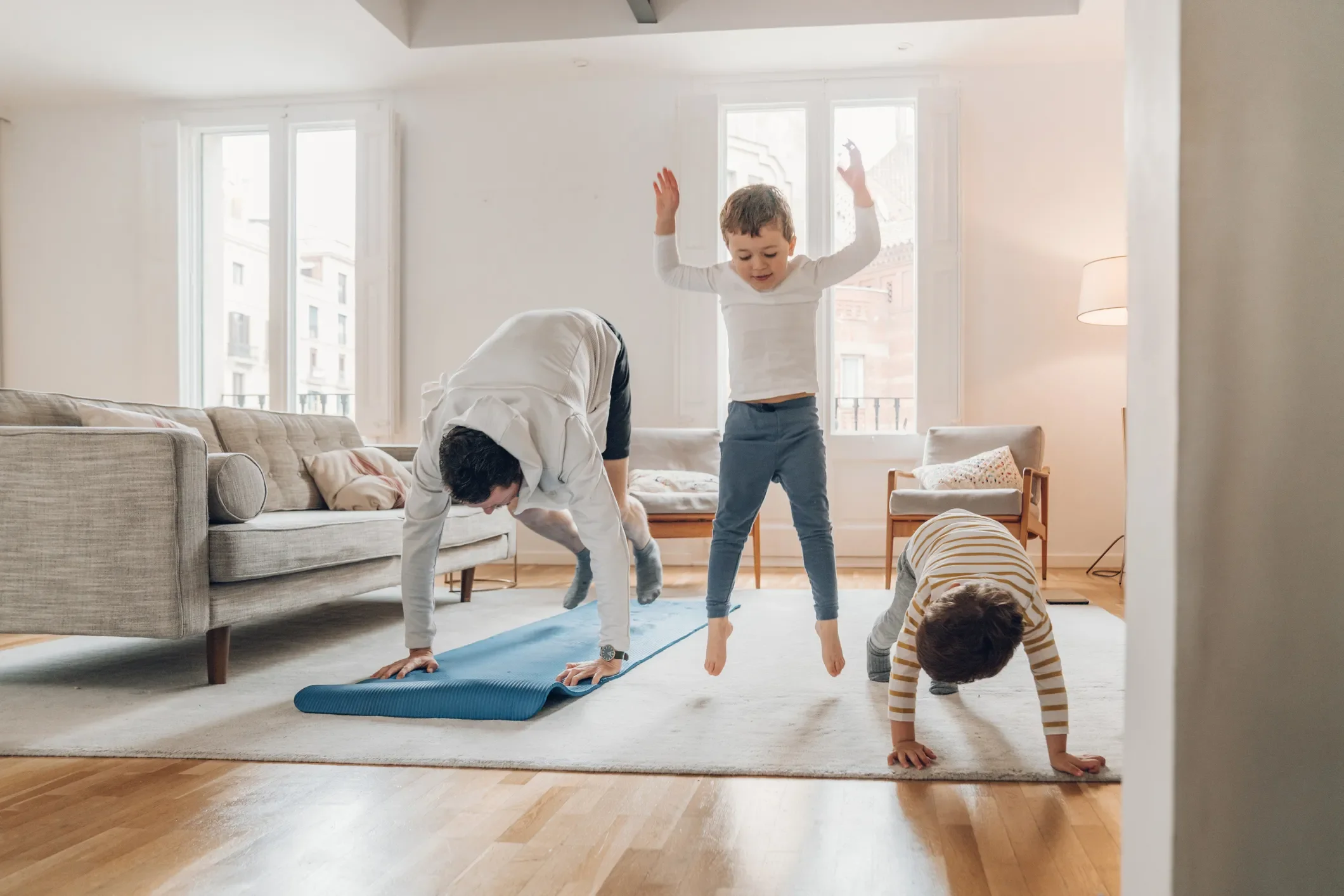 young family doing yoga