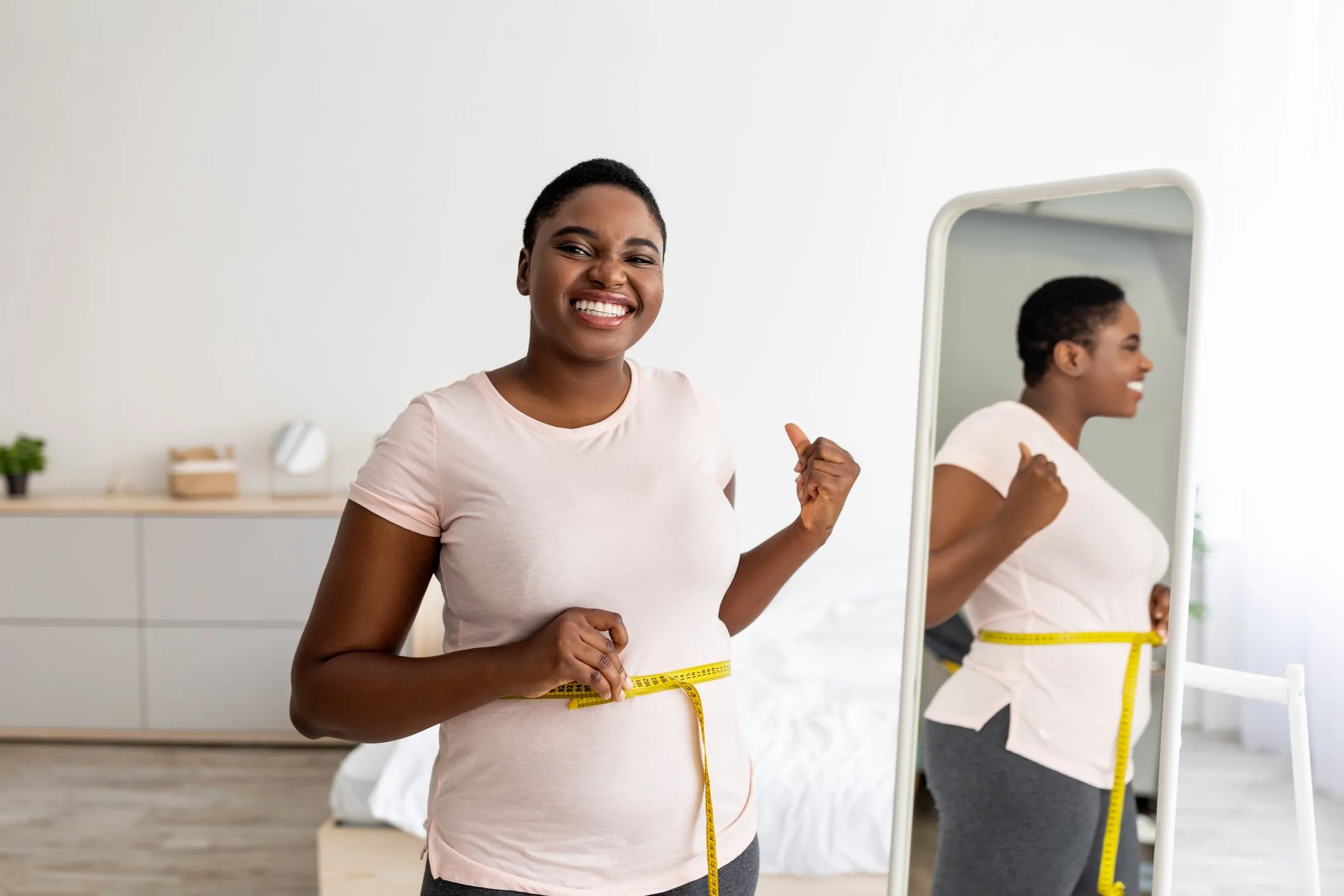 a woman showing her weight loss