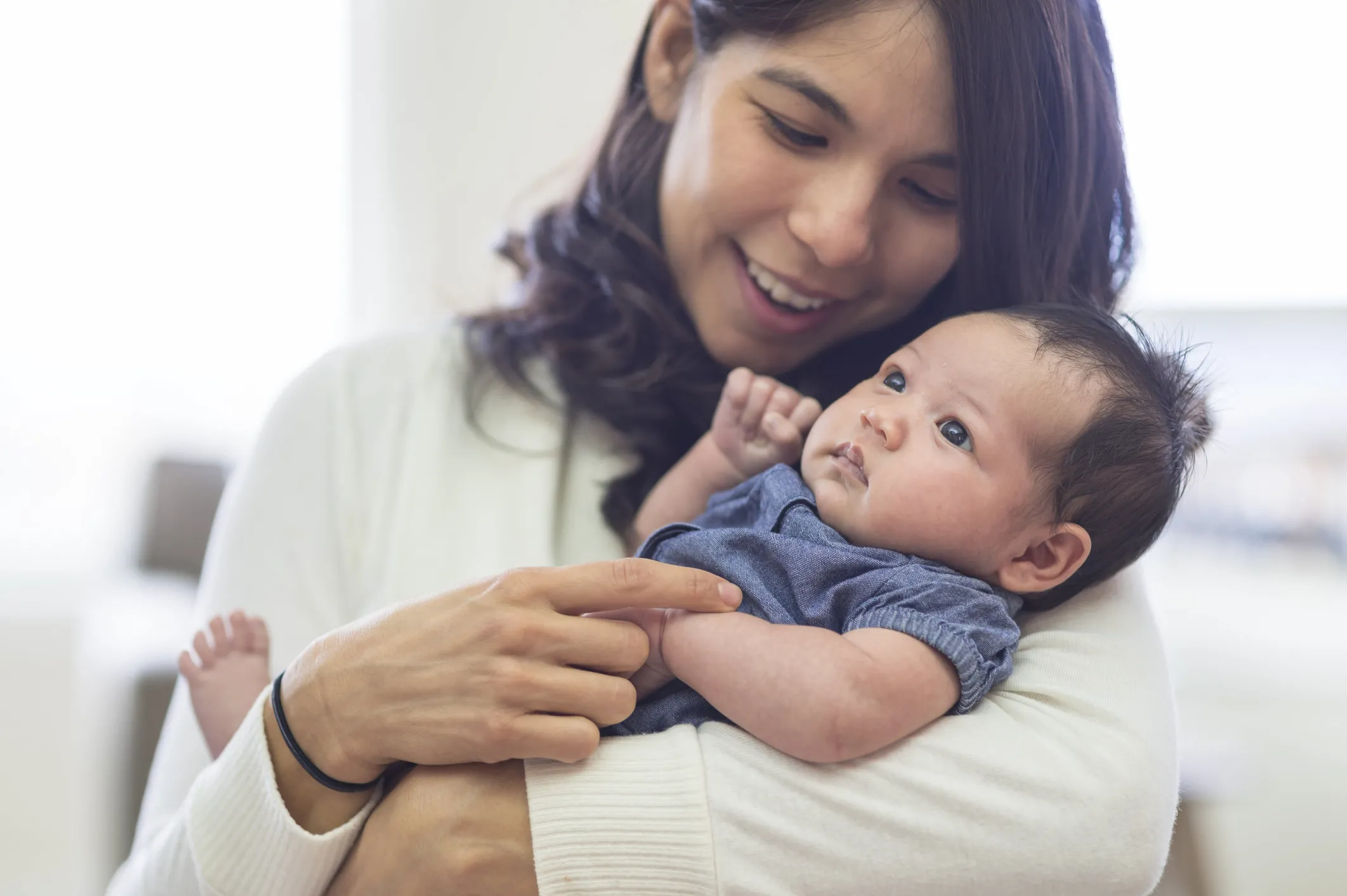 mom holding baby