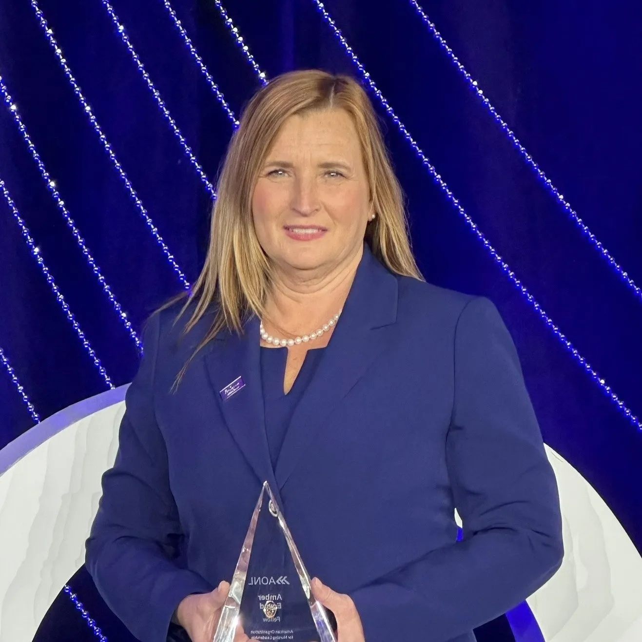 Amber Egyud, DNP, RN, NE-BC, FAONL, Chief Operating & Nursing Officer at Chesapeake Regional Healthcare, accepting her award.