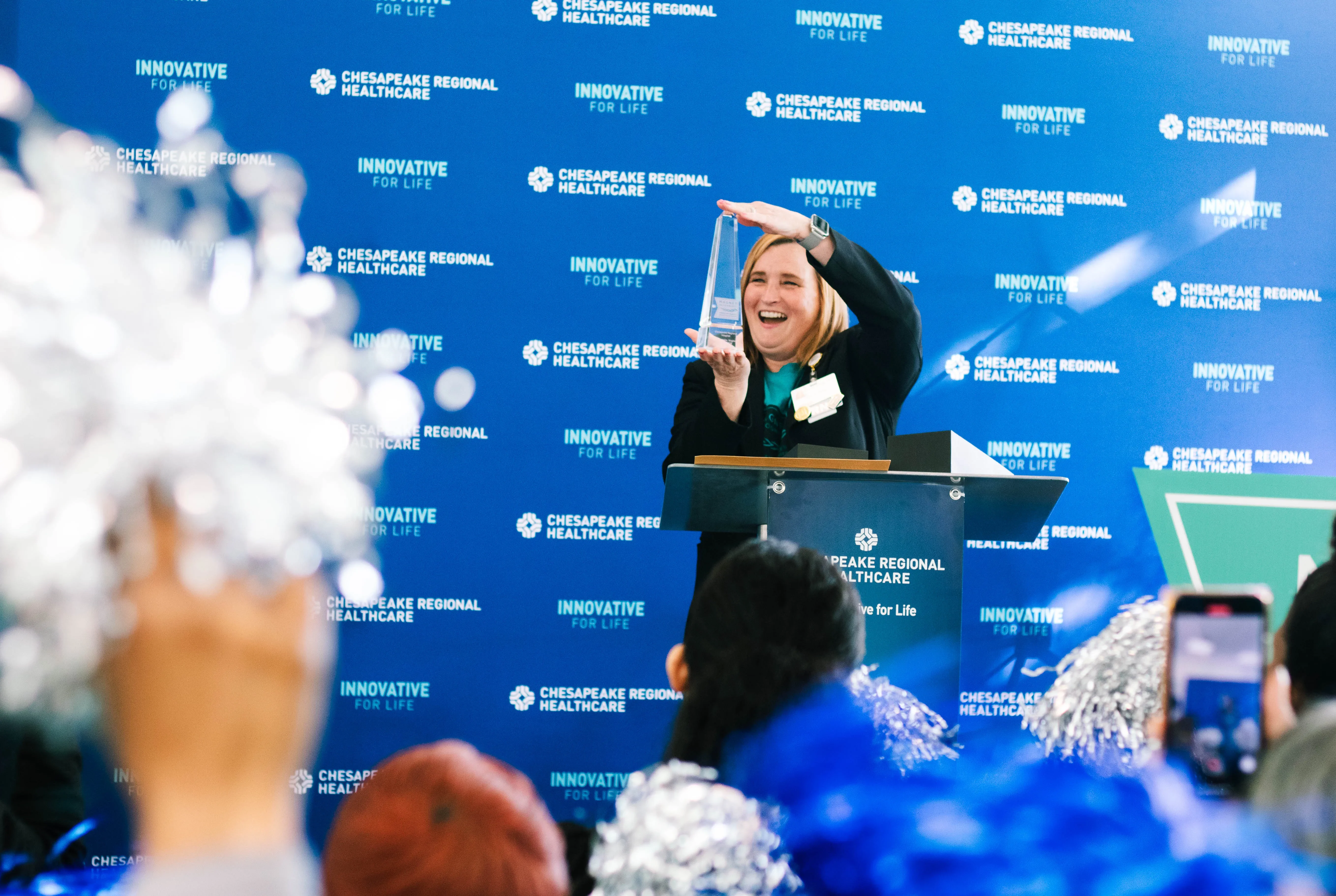 Amber Egyud, Chief Operating & Nursing Officer holds the Magnet trophy