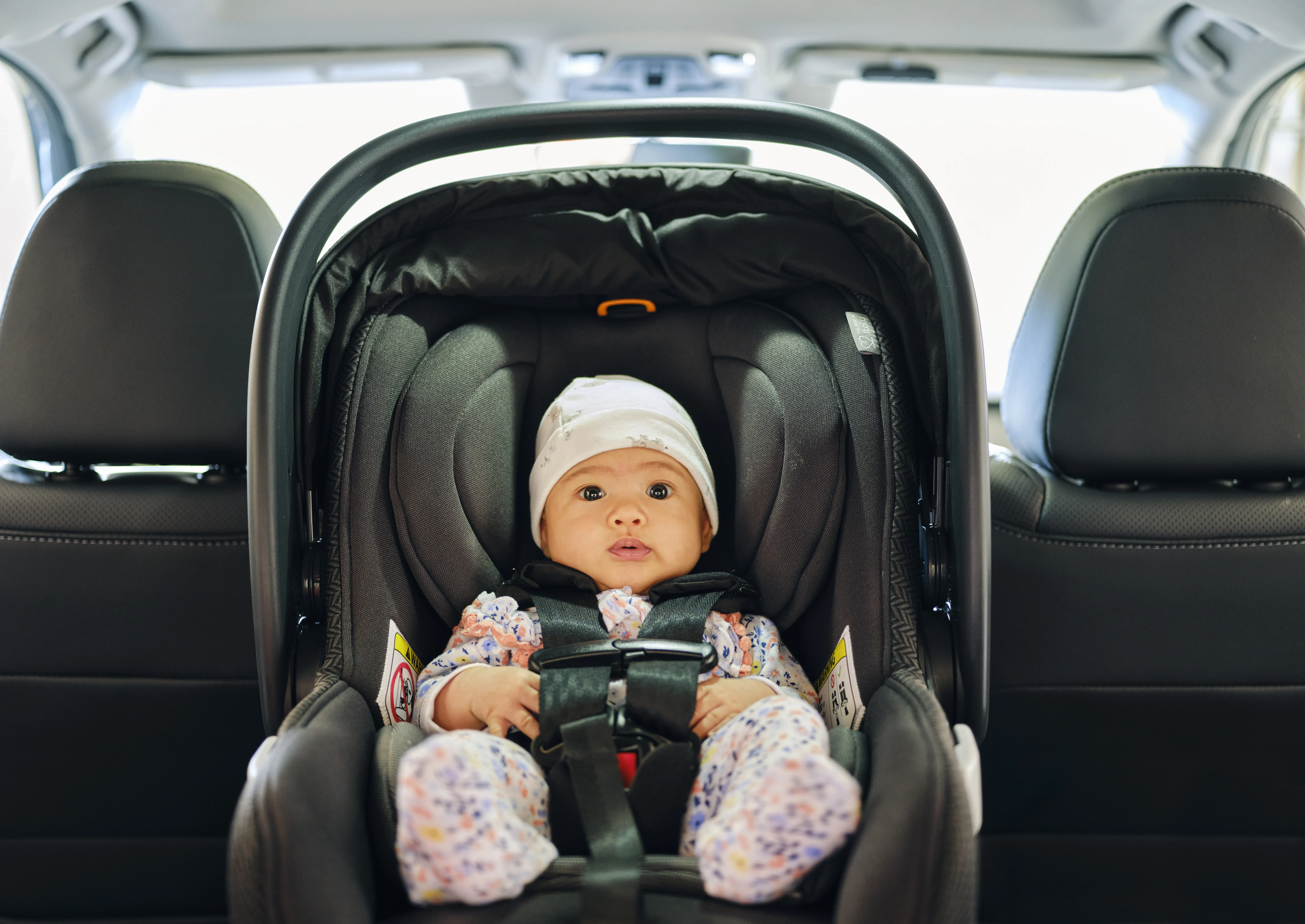 Infant Strapped Safely In Car Seat