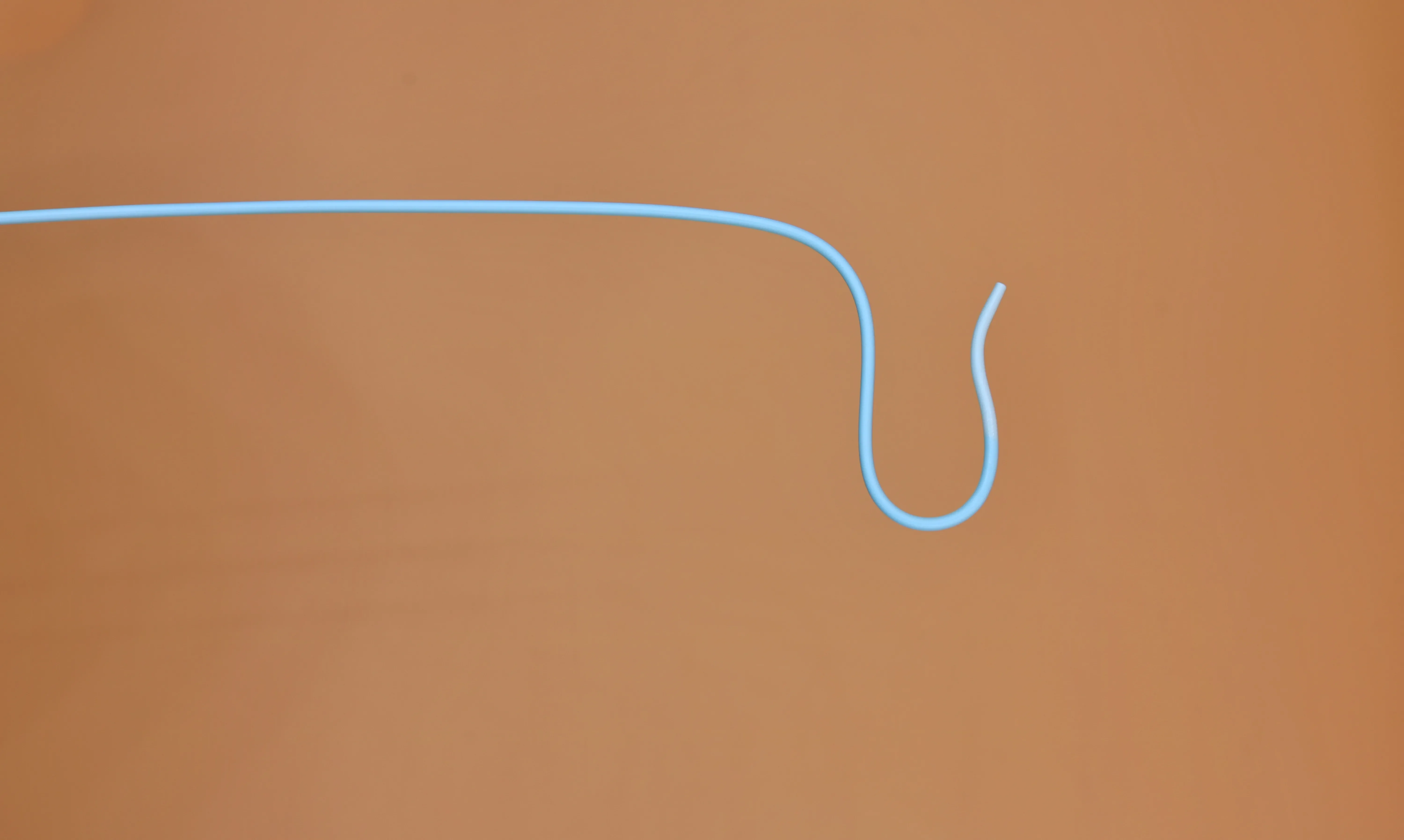 A curved diagnostic catheter used in interventional radiology and cardiology
