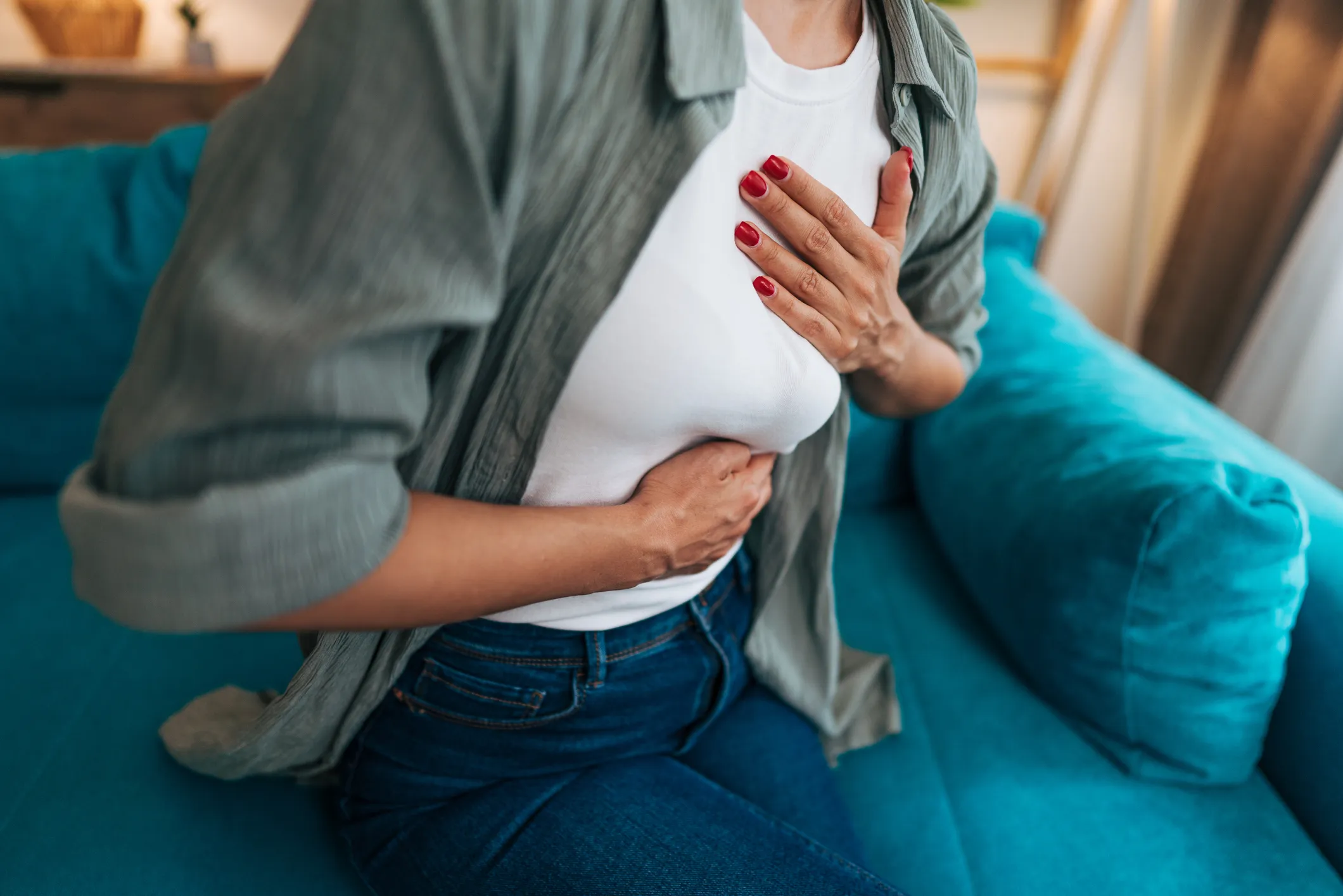 woman clutching chest and stomach