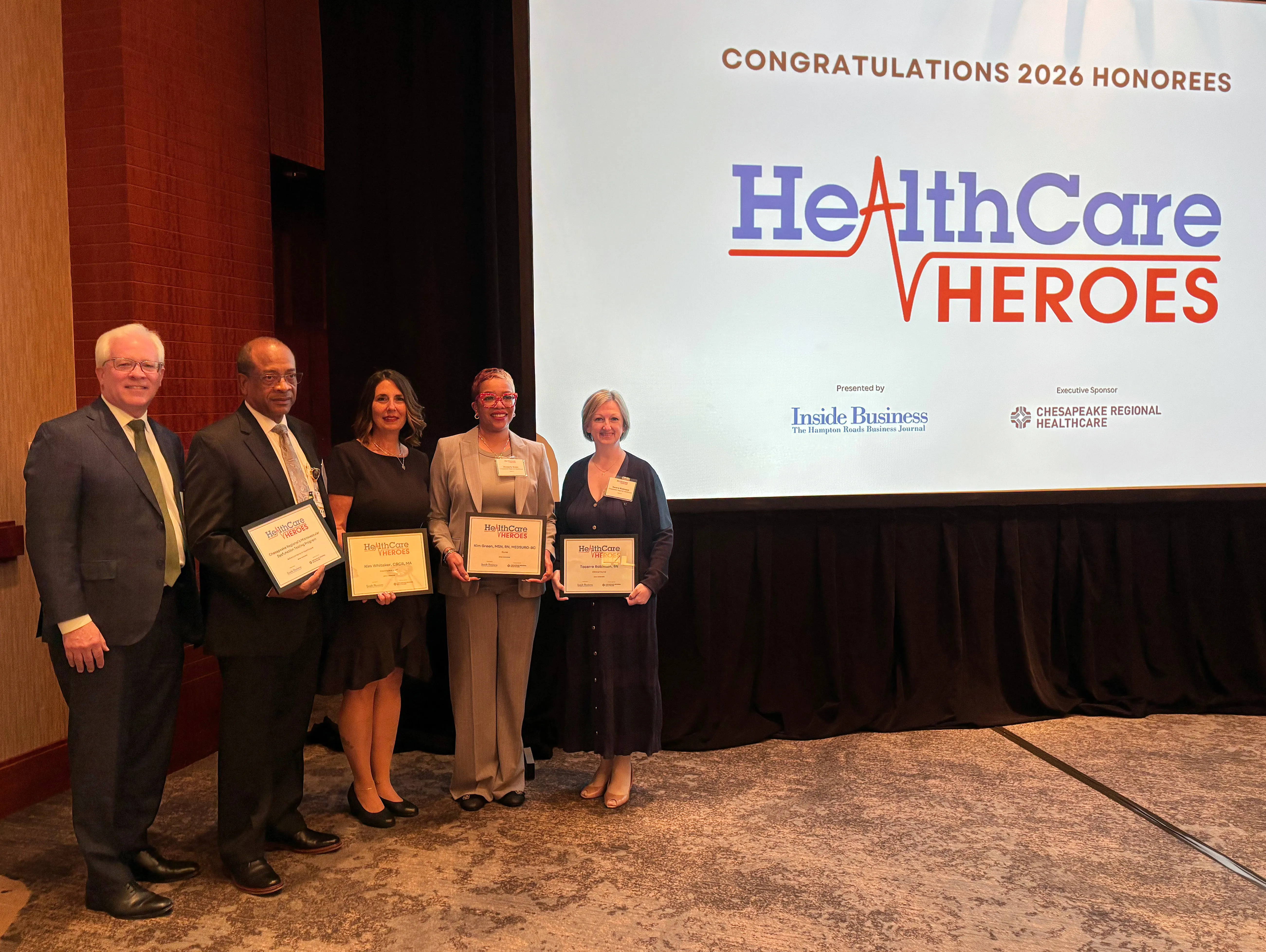 Reese Jackson with Healthcare Hero winners (L-R): Kimberly Whitaker, Cari Robinson, Kimberly Green, Sherwood Moore, standing in for Dr. Ashesh Buch.